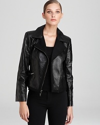 Brimming with urban attitude, this DKNY jacket features sleek zip accents and subtle distressing for modern edge. The irreverent silhouette puts a racy spin on the most basic of styles.