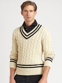 Fashioned in a heritage cable knit from luxe Italian cotton, a classic V-neck sweater is adorned with cricket stripes and herringbone wool elbow patches for authentic style.V-neckRibbed collar, cuffs and hemElbow patch detailCottonHand washImported