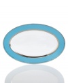 Get away from ordinary dining with dreamy Lauderdale dinnerware by Cru. Shimmering platinum dots and bands contrast swaths of sea blue on this fuss-free, dishwasher-safe oval platter inspired by a favorite Floridian retreat.