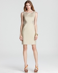 Intricate embroidery slithers across this Elie Tahari dress for a textured python print that pops from the beige silhouette. Pair with nude pumps for a racy take on neutrals.