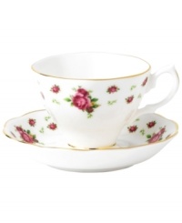 Revive a classic dinnerware pattern with the Vintage cup and saucer. Lush blossoms plucked from Royal Doulton's Old Country Roses collection flower on white bone china with ruffled gold edges.