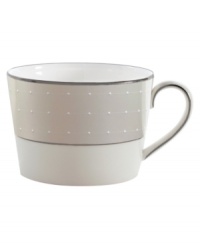 Elegant and modern, this fine china teacup adds subtle definition to the rest of the Étoile Platinum collection. From innovative designer Monique Lhullier, it features a pearlescent border with glossy raised dots and a fine stitch-like pattern.