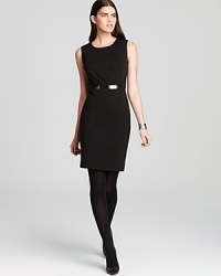 Careful draping and a patent belt craft a smart, sophisticated Calvin Klein dress, essential for your 9-to-5 and wherever the after-hours may take you.