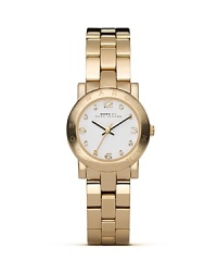 Make time for shine. It might be mini but this gold-plated stainless steel watch from MARC BY MARC JACOBS makes a major round-the-clock statement.