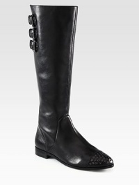 Grommet detailing adds edgy-chic style to this tall leather silhouette with adjustable buckle straps. Stacked heel, 1 (25mm)Shaft, 15½Leg circumference, 14Leather upperSide zipAdjustable buckle strapsLeather lining and solePadded insoleImported