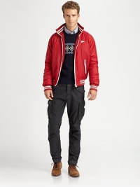 A contemporary interpretation of a classic varsity jacket is crafted from sleek, resilient nylon with contrast piping and chest logo detail.Zip frontStand collarWaist zip pocketsBanded cuffs and hemFully linedAbout 26 from shoulder to hemPolyesterMachine washImportedOUR FIT MODEL RECOMMENDS ordering true size. 