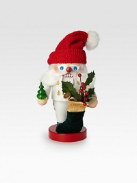 White-clad Father Christmas nutcracker is entirely hand-crafted in Germany, wearing a red knit hat and carrying a velvet stocking filled with gifts.6½ X 6 X 11HCarved woodMade in Germany