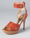 Orange patent trim adds a pop of color to the Belvar sandals from GUESS.