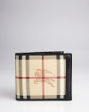 Signature elegance: Burberry's check wallet adorned with the equestrian logo makes a dramatic contribution to your everyday life. Every time you pull it from your pocket, people will see that you're a man of distinction. Crafted in fine leather for longevity.