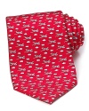 Crafted in luxuriously soft silk, this handsome tie from Vineyard Vines is adorned with a vivid airplane pattern.