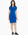 A chic snapped placket and contrasting polo collar lend a modern edge to a timeless polo dress.