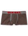 Red and green horizontal stripes coordinate with the logo waistband on these bold trunks from Diesel.