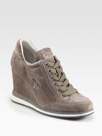 Suede sneakers with a silvertone logo, elevated by a covered wedge. Self-covered wedge, 3½ (90mm)Suede upperLeather liningRubber solePadded insoleImported