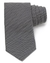 Carefully woven for a handsome check design, this premier tie from Armani Collezioni is made from lavish Italian silk for a luxurious addition to your wardrobe.