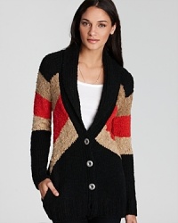 Striking color blocked details--the rage-worthy trend of fall--lends a bold look to this cozy knit Free People sweater.