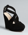 Loeffler Randall wedges sophisticated style into a must-have basic, with elegant criss-cross straps in plush suede.