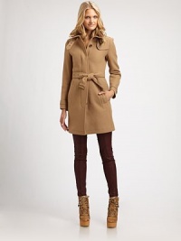 Featuring a waist-defining belt, a simply brilliant style with timeless military details.Stand collarEpaulettesGunflapConcealed button closure Belted styleSlash pocketsBack yokeBack princess seamsBack ventAbout 33 from shoulder to hemWool/polyamide/cashmereDry cleanImportedSIZE & FIT Model shown is 5'10½ (179cm) wearing a US size 4.This style runs true to size. We recommend ordering your usual size for a standard fit. 