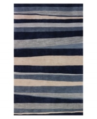 A bold, striped pattern fashioned in rich shades of blue and beige creates a captivating look that integrates beautifully with any transitional or contemporary decor. Rife with lush texture and detail, this luxurious area rug from Dalyn is beautifully hand tufted in polyester and acrylic, ensuring superior color retention and long-lasting wear.