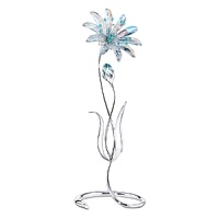 The beautiful Dellaria is made of Aurora Borealis crystal which refracts light, changing color at different angles. There is a bud and accents on the stamen in Aquamarine crystal. The flower comes with leaves on a silvertone metal stand. This large flower adds a beautiful touch to any home.