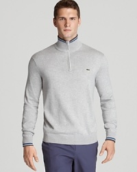 Stripe trim detail and a signature croc at the left chest enhance this soft, comfortable sweatshirt from Lacoste.