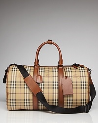 Ready for a weekend in the city or an escape to the country lodge, the Vintage Haymarket leather weekender features Burberry's signature plaid, tote handles and an adjustable shoulder strap.