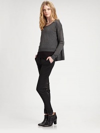 Ultra-soft with a hint of stretch, this hi-lo design with ribbed trim has instant appeal. ScoopneckLong sleevesDropped shouldersPull-on styleRibbed trimSide slitsAbout 18 from shoulder to hem83% viscose/17% nylonHand washImported of Italian fabric Model shown is 5'10 (177cm) wearing US size Small. 