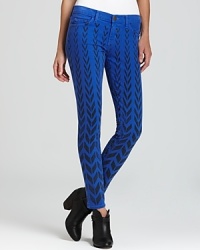 Update your denim wardrobe with these bold chevron-print Current/Elliott cropped skinny jeans, for a modern take on tribal.