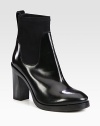 Instantly cool and on-trend, this shiny leather and stretchy neoprene ankle boot is a wardrobe must-have. Stacked heel, 4¼ (110mm)Stacked platform, ½ (15mm)Compares to a 3¾ heel (95mm)Shiny leather and neoprene upperPull-on styleLeather liningRubber solePadded insoleMade in Italy