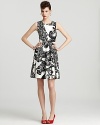 An elegant paisley print meets a bold black-and-white palette for retro glamour infused with modern edge. Finish the kate spade new york dress with a slash of lipstick and color-pop heels for a party-ready style.