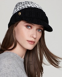 MICHAEL Michael Kors crafts a brimmed cap out of chunky yarn and adds shiny gold-tone button details.