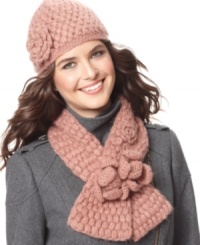 Wrap yourself in romance. The thick-knit Rosemary scarf by Fossil blooms with rosettes.