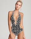 Sultry swimwear gets a warm welcome to the jungle in this Trina Turk zebra patterned piece. A plunging v neck and open back add to the allure of this must-have monokini.