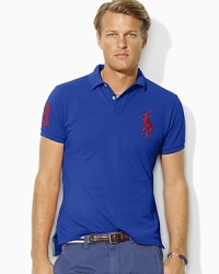 Designed with a trim cut through the body and a shorter hem, this short-sleeved polo shirt is crafted from breathable cotton mesh with Ralph Lauren's Big Pony.