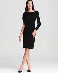 Armani Collezioni updates the all-essential LBD with asymmetric sleeves and a draped silhouette for a fashion-forward look. Team with sleek pumps for minimalist chic.