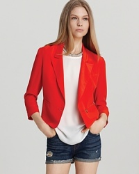 Make a modern statement in this bold Joie blazer, cut with three-quarter sleeves and three front slit pockets. For an edgy downtown look, layer over a sheer white tee with distressed denim cut-offs and take your look from day to night.