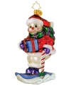 Extremely cheerful conditions on the slope turn this sporty snowman into a star. He careens down the mountain in style, dressed in head-to-toe glitter with candy cane poles and classic Christopher Radko style.