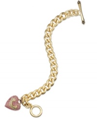 Juicy Couture's lovely bracelet gets your heart racing with a banner heart charm embellished with pink pave accents. Complete with a toggle closure. Chain crafted in gold tone stainless steel. Charms crafted in gold tone mixed metal. Approximate length: 7 inches. Approximate drop: 1 inch.