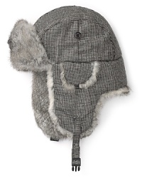 A distinguished tweed hat in a classic aviator shape gets a boost of luxury from the rabbit fur trim, a decadent touch with timeless masculine appeal.