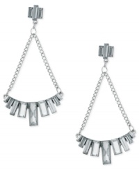 Chandelier chic from GUESS. These drop earrings flaunt baguette-cut crystal stones placed in a row, strung from linked chains. Crafted in imitation rhodium tone mixed metal. Approximate drop: 3 inches.