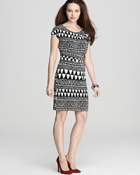 This slinky VINCE CAMUTO dress gets graphic with a mixed optic print and wide banded waist.