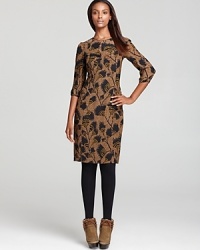 This Burberry London day dress in a unique feather print is a sophisticated wardrobe staple that will stand the test of time. Pair it with heels or booties to dress it up or down!