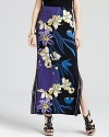 Blooming with graphic florals and saturated in after-dark shades, this T Tahari maxi skirt lends modern elegance to your summer style. Generous side slits set the stage for strappy sandals.