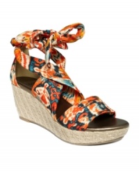 Vacation is never far away with the Gee sandals by Impo on your feet. Their woven wedge heel and wraparound ankle tie are bold and beach-ready.