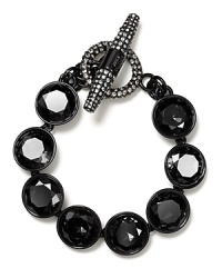 Round faceted stones light up your wrist. Bracelet by Juicy Couture.