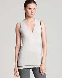 Trimmed with latex, Helmut Lang's v neck tank is the ultimate acquisition when you want a layering piece with uniquely modern edge.