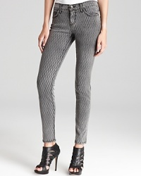 Fall foremost style, these fishnet-print Current/Elliott jeans are worth going wild for. Rock the skinnies with tough-luxe booties on the downtown scene with your hautest attitude.