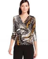 A feather-inspired print adorns this faux-wrap style top from Calvin Klein, sure to add a fashionable flourish to a pair of black pants or a pencil skirt. (Clearance)