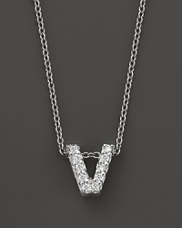 From the Tiny Treasures collection, a diamond V necklace. With signature ruby accent. Designed by Roberto Coin.