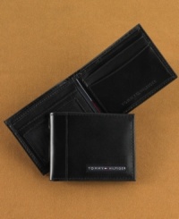 A classic wallet for everyday, this smooth leather billfold comes in a sleek, slim design from Tommy Hilfiger.