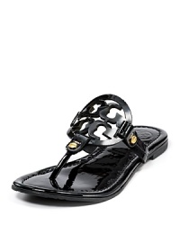 Tory Burch Miller signature flat sandals. Laser cut logo and gold tone hardware on these dainty, colorful sandals.